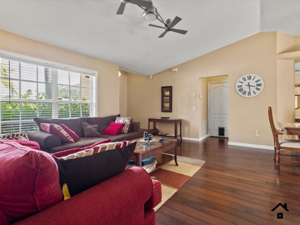 Empty living room in a Port St. Lucie house that is no longer being used by the owner