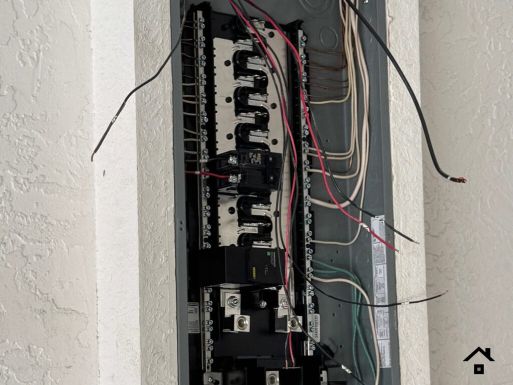 Open electrical panel during a replacement for a recalled panel.
